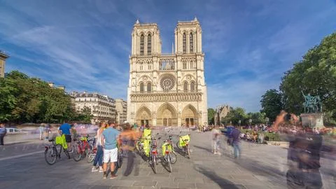 Front facade of cathedral of Notre Dame de Paris, with square full of walking Stock Photos