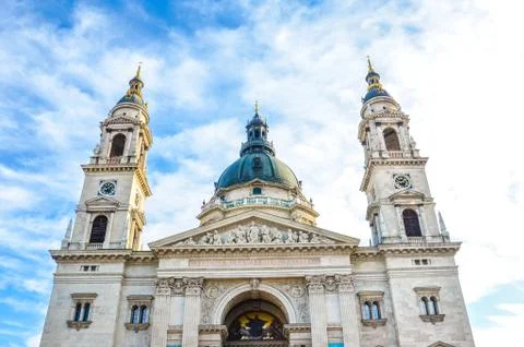 Front facade of St. Stephen's Basilica in Budapest, Hungary on with blue sky and Stock Photos