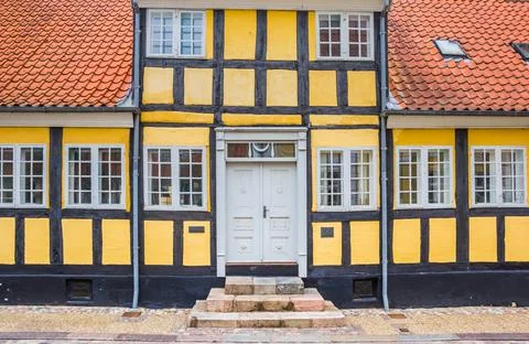 Front facade of a yellow half timbered house in Viborg Stock Photos