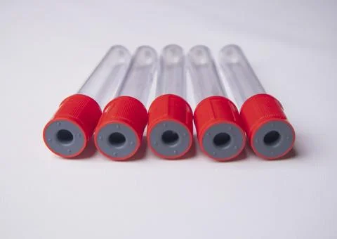 Front-facing, close-up shot of five empty medical blood collection tubes wi.. Stock Photos