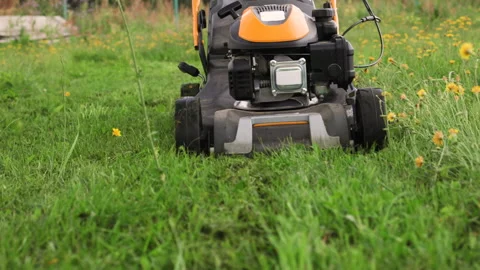A front facing detailed view of a lawn mower with wheels. Stock Footage 316493785