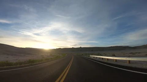 Front Facing Driving Plate Into Sunset. American Utah Highway. Drive Arches Stock Footage 258476540
