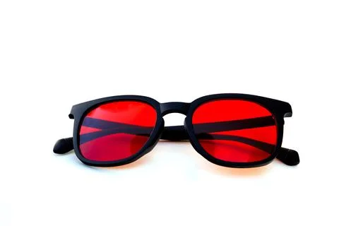 Front-facing red tinted glasses with black frame, ideal for nighttime screen  Stock Photos