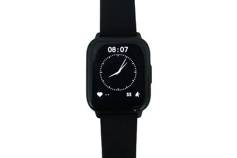 Front-facing view of a black smartwatch featuring a rectangular case, an ac.. Stock Photos