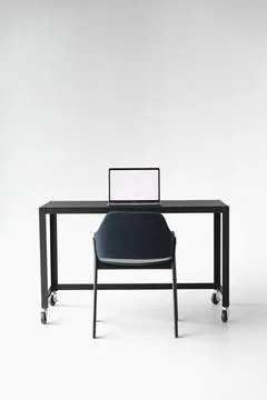 Front facing view of clean desk and chair setup Stock Photos