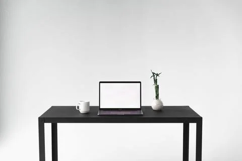 Front facing view of minimal desk setup Stock Photos