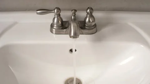 Front Facing View of Water Running Bathroom Sink Hot and Cold Water Stock Footage 197008991