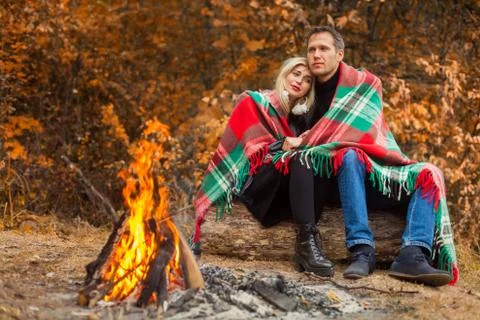 In front of fire is couple Stock Photos