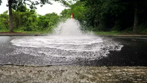 In front of fire hydrant while water is spraying out. Stock Footage 139669515