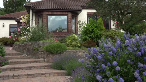 Front garden and path of bungalow, England Stock Footage 53048429