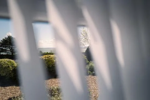 Front garden or front yard with a seascape through a window Stock Photos