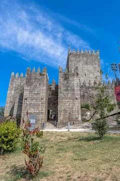 Front gate and facade view at the Castle of Guimaraes, a medieval castle Stock Photos