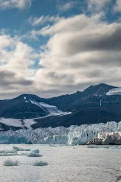 Front of glacier at dusk Stock Photos