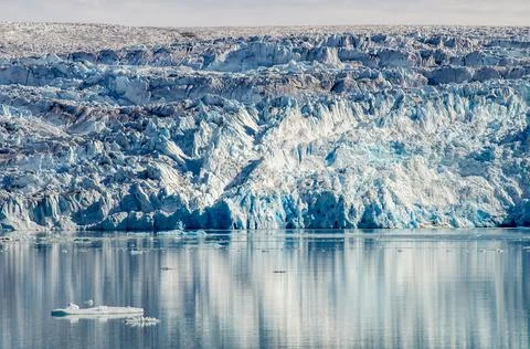 Front of a glacier with flat sea Stock Photos
