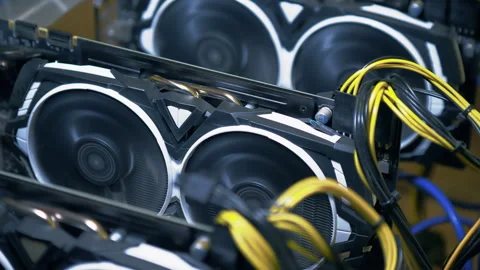 Front graphics card fans and PCIe cables inside open GPU mining rig Stock Footage 344136488