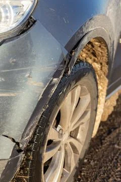 Front of gray crossover car get damaged by crash accident on the road. Stock Photos