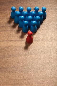 In front of the group, figurine concept on table Stock Photos