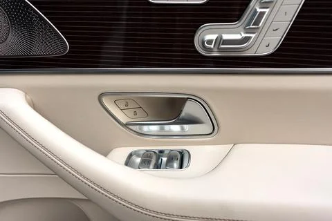 Front handle door panel with buttons of a luxury car Photos