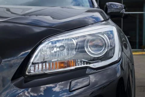 Front headlight of a black car Stock Photos