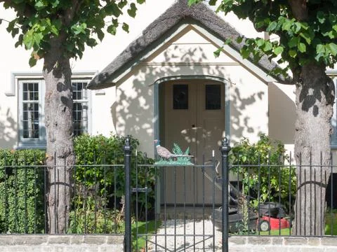 Front house gate and rail with unique cockerel structure Stock Photos