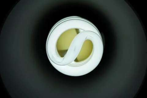 Front image of a white energy saving bulb on Stock Photos