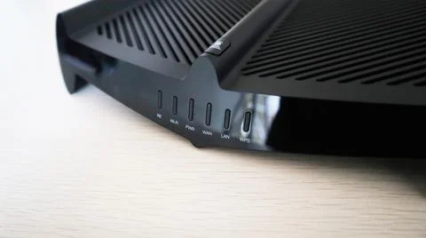 Front indicator panel on a black wireless router Stock Photos