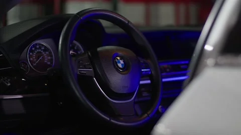 Front instrument panel and driver's steering wheel of a BMW vehicle. Video stock 233841233