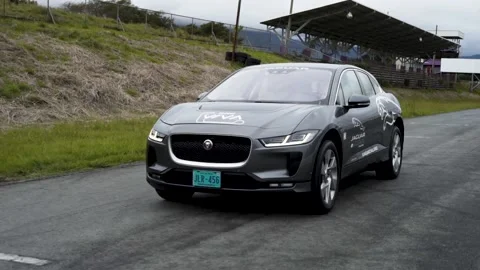 Front of jaguar i pace electric gray car on race track Stock Footage 155606114