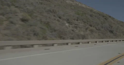 Front left driving plate - Highway 1 at Mile 75, Gorda Stock Footage 294931305