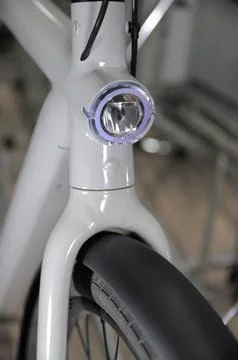 Front light mounted on an electric bicycle fork Stock Photos