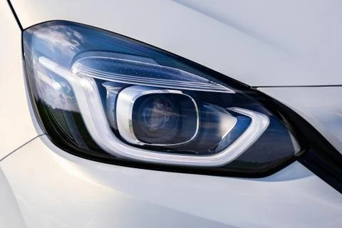 Front light of a white car Stock Photos