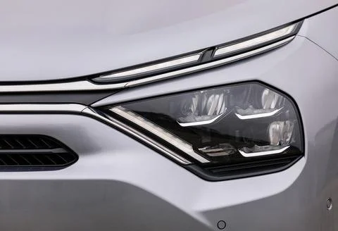 Front lights of a silver car Stock Photos