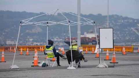 Front Line Covid workers at test site Stock Footage 129523192