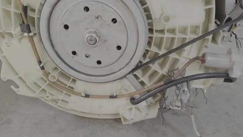 Front Load Washing Machine Drum with Worn Out Shock Absorbers Stock Footage 334855079