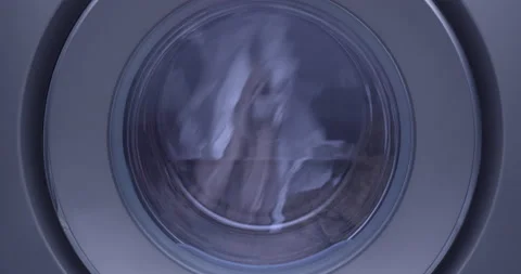 Front Load Washing Machine Spinning with Clothes inside without foam Stock Footage