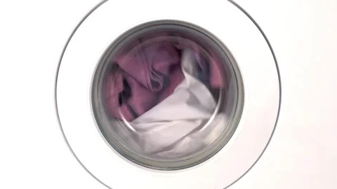 Front-Load Washing Machine Spinning Clothes in Laundry Room Stock Footage 300820855