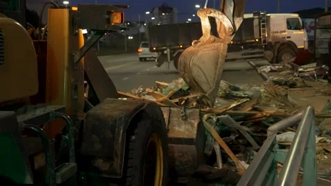 Front loader and excavator remove construction debris Stock Footage 170293817