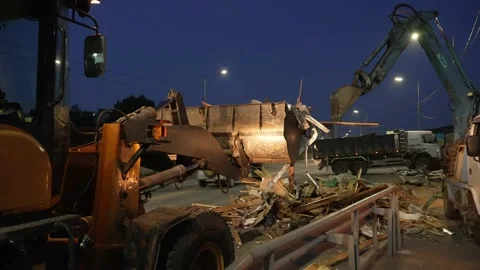 Front loader and excavator remove construction debris Stock Footage 170293943