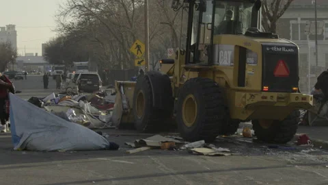 A front loader cleans up homeless camp, Salt Lake City, Utah. Video stock 146820081