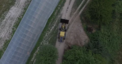 Front Loader Drives Down Dirt Road Stock Footage 270275870