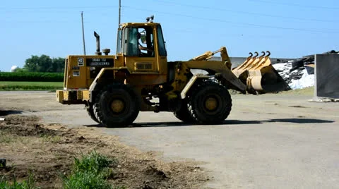 Front Loader Filling Cattle Feed Trailer 2 Stock-Footage 26466880