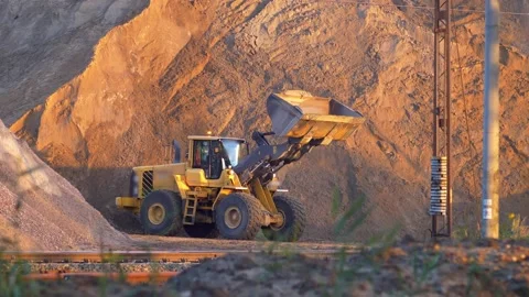 Front Loader Next to Huge Heap of Sand on Construction Site Stock Footage 139896239