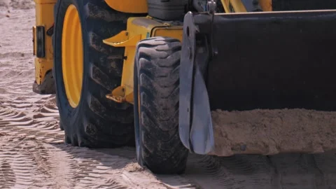 Front loader tractor working on construction site moving sand and dirt with.. Stock Footage 339763847