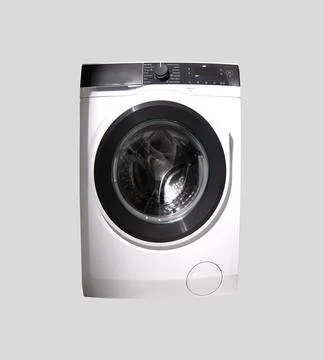 Front-loading washing machine with a circular glass door and digital control Stock Photos