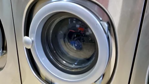 Front-Loading Washing Machine in Operation - Laundry Appliance Stock Footage 315171731