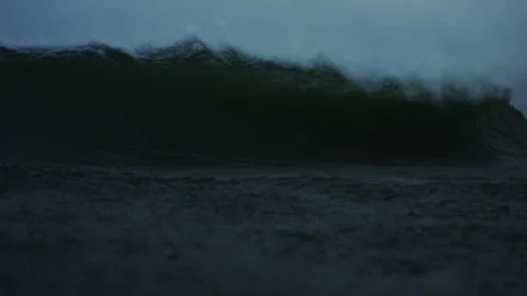 Front low view of lip of ocean wave crashing onto surface exploding in Video stock 281155059