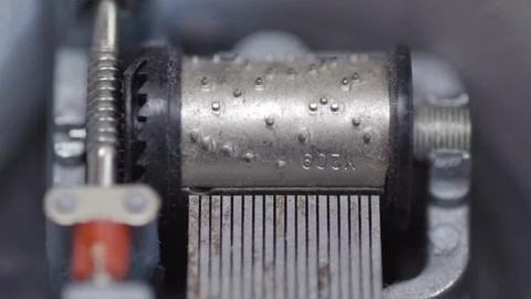 FRONT ON MACRO OF SMALL WIND UP MUSIC BOX PLAYING Stock Footage 126421525