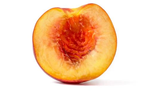 Front macro view of appetizing half peach as a wallpaper Stock Photos