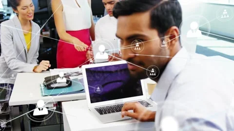 Front man turning to camera, peer tapping, pointing, network over laptop for Stock Footage 333733273