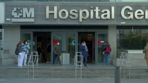 Front medium shot of hospital La Paz's main entrance in Madrid Stock Footage 213907612
